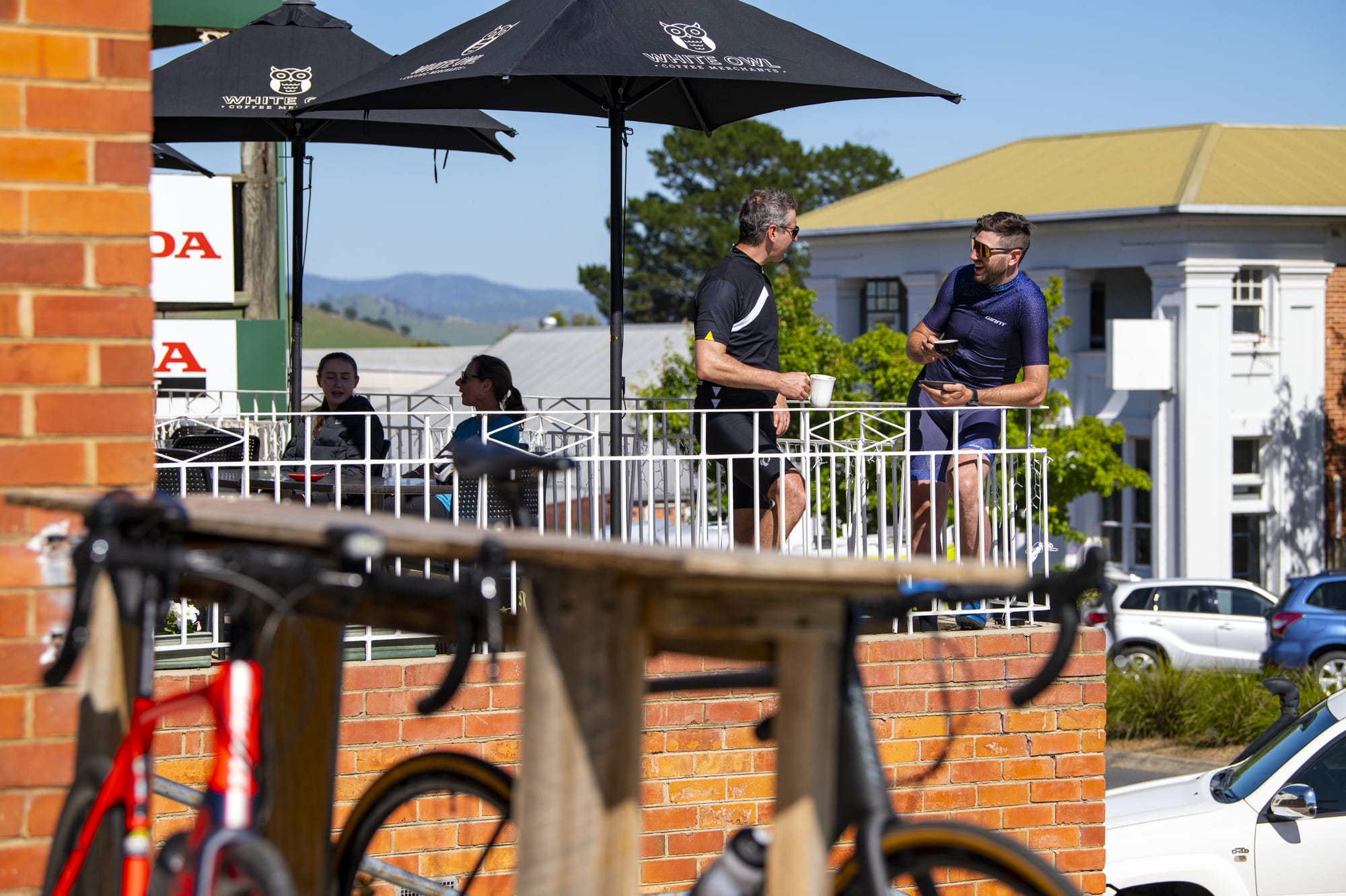 Two cyclists enjoying coffee in Corryong