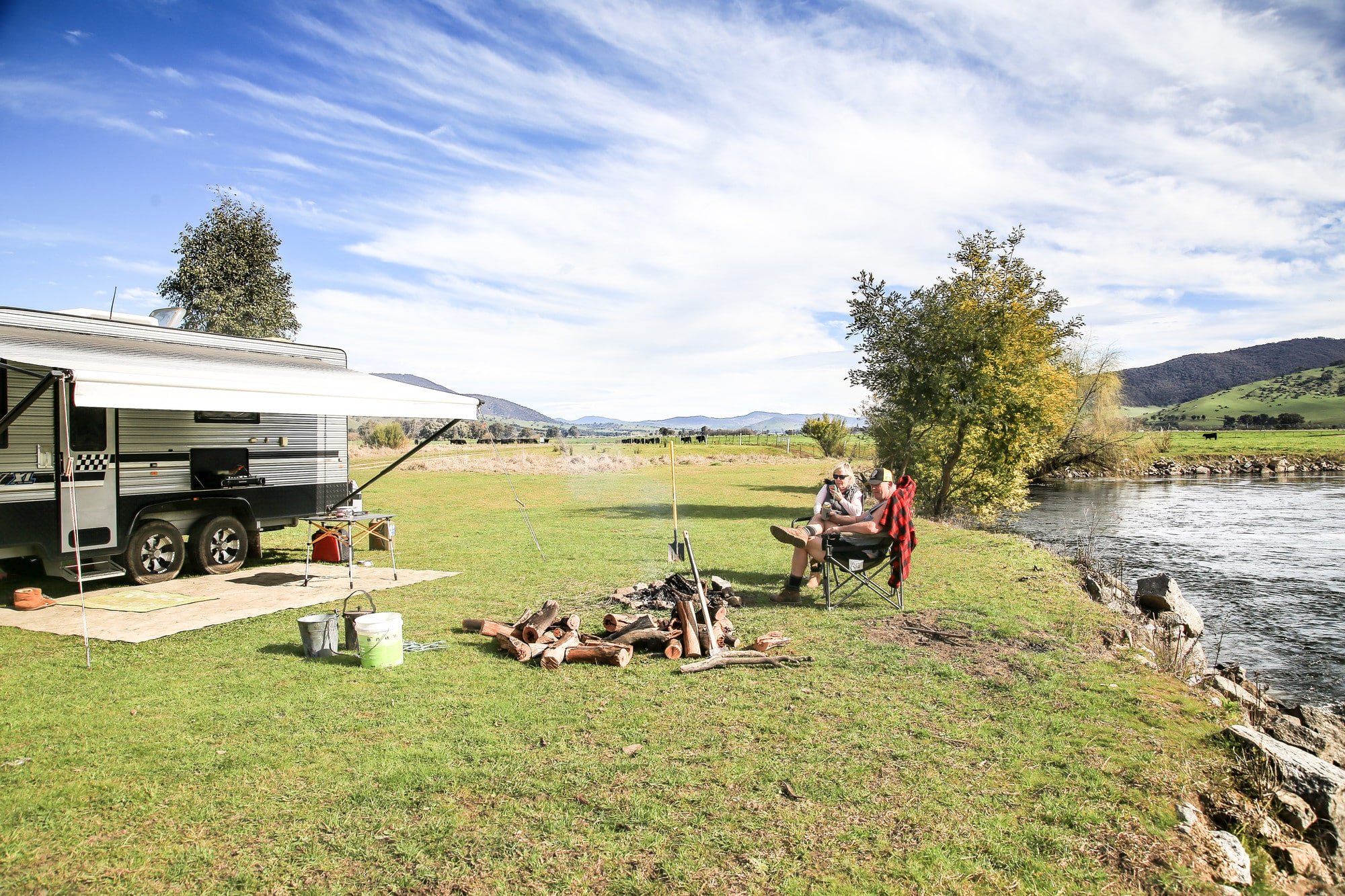 Couple camping by a river in the Upper Murray