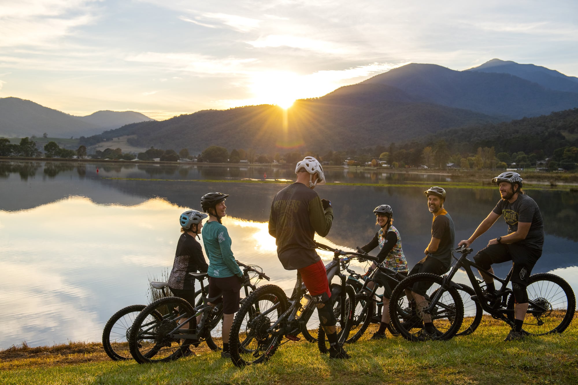 Group of cyclists enjoying the sunset at Mount Beauty pondage