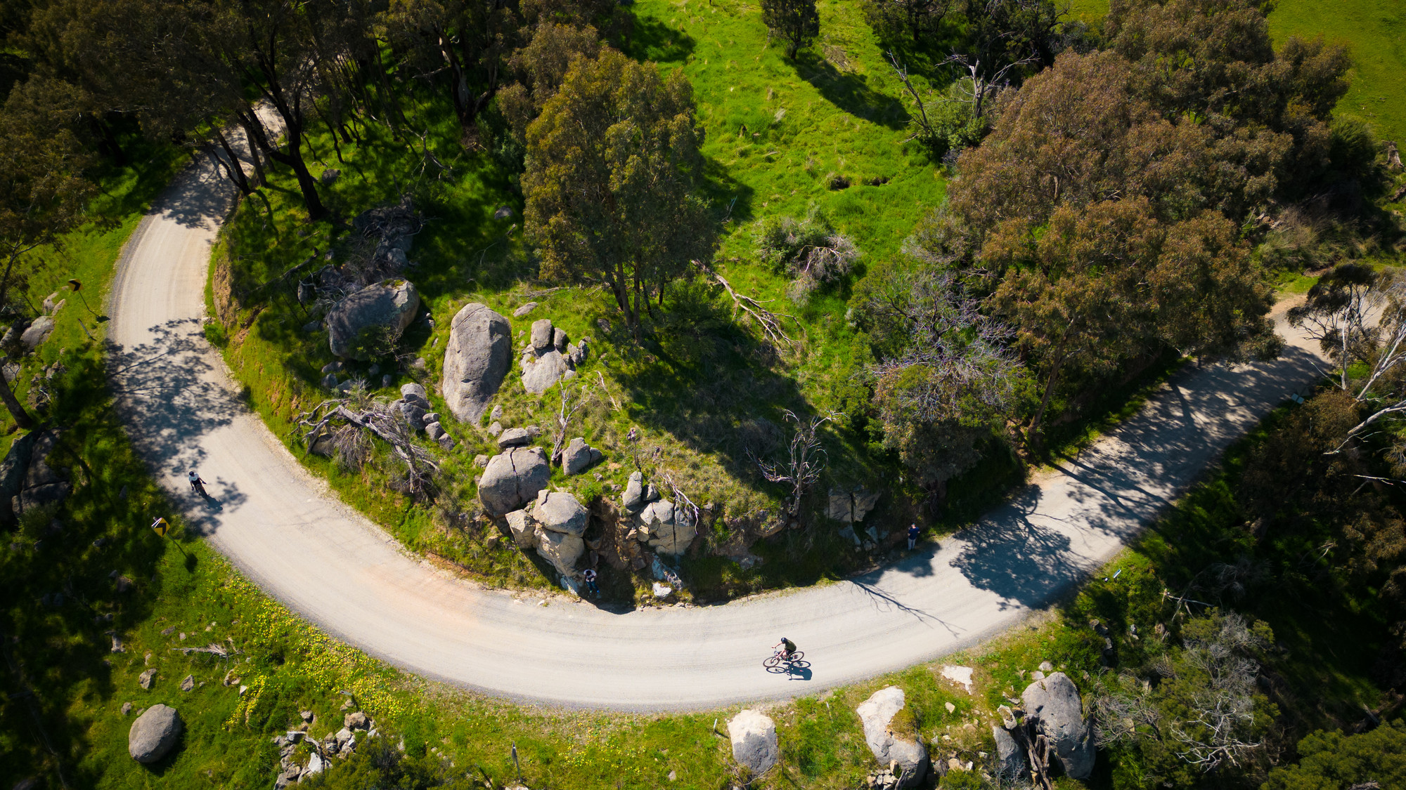 Cyclist riding gravel roads through Yea's rolling hills