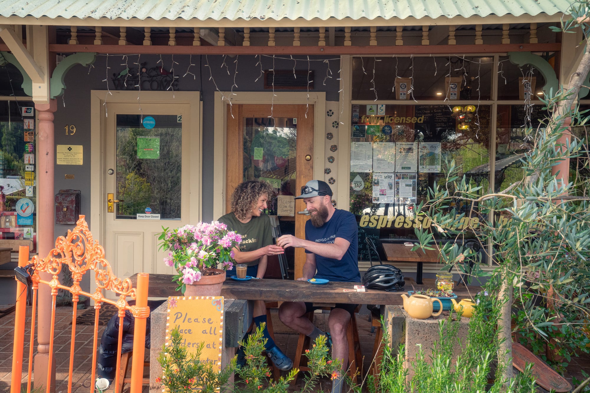 Two cyclists enjoying coffee at a Marysville Cafe