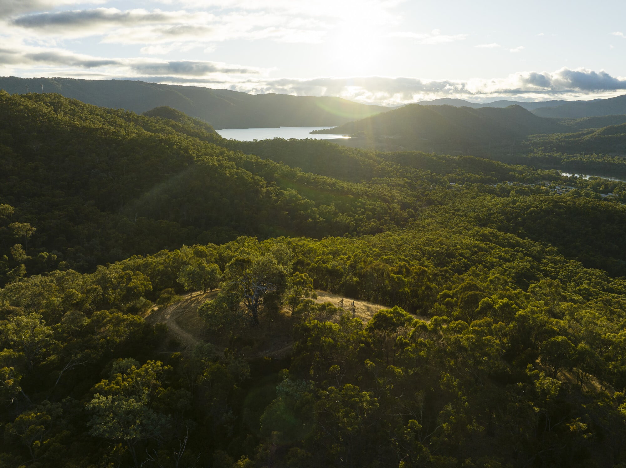 Birdseye view of Eildon Mountain Bike Park featuring two riders and Lake Eildon